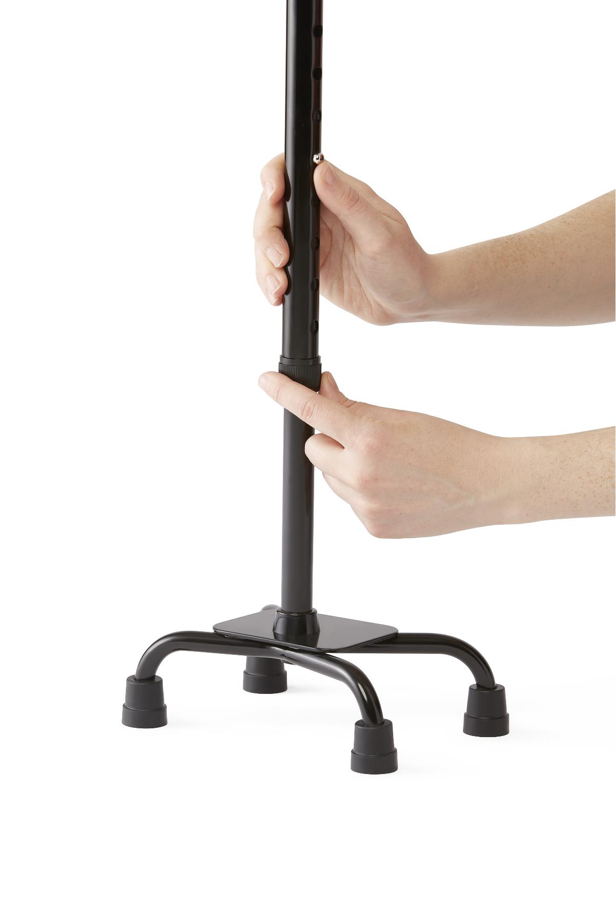 Close-up of the Medline Aluminum Quad Cane's small base for stability.