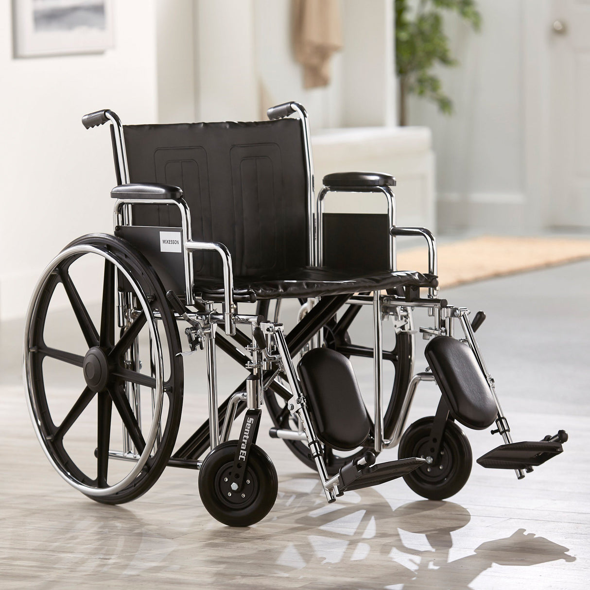 Bariatric Wheelchair McKesson Dual Axle Desk Length Arm Swing-Away Elevating Legrest Black Upholstery 24 Inch Seat Width Adult 450 lbs. Weight Capacity - BeHope