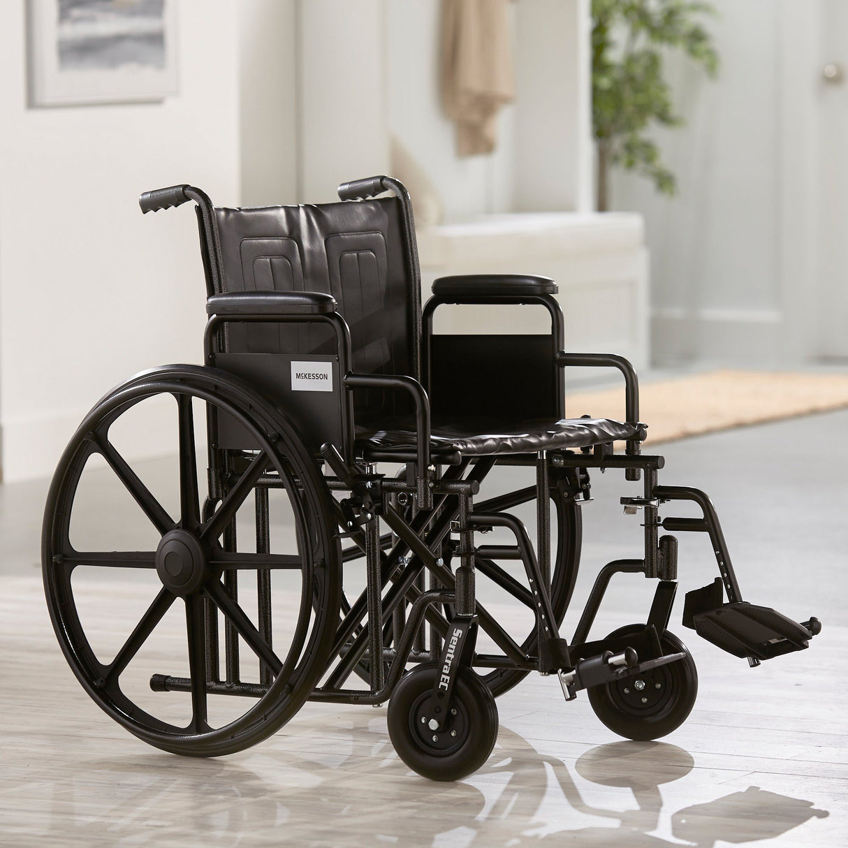 Bariatric Wheelchair McKesson Dual Axle Desk Length Arm Swing-Away Footrest Black Upholstery 22 Inch Seat Width Adult 450 lbs. Weight Capacity - BeHope