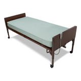 Detail view of a vinyl innerspring homecare mattress, highlighting material and texture.