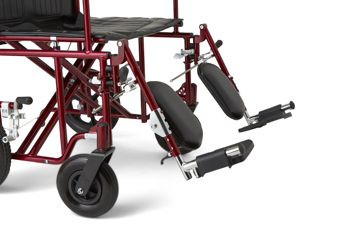 Medline Freedom Plus Light Bariatric Transport Chair, side view, with user.