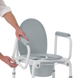 Medline Steel Drop-arm Commode, detailed view of the commode pail and seat.