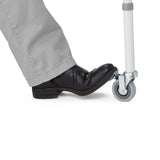 Medline Steel Drop-arm Commode, demonstrating height adjustability for user comfort.