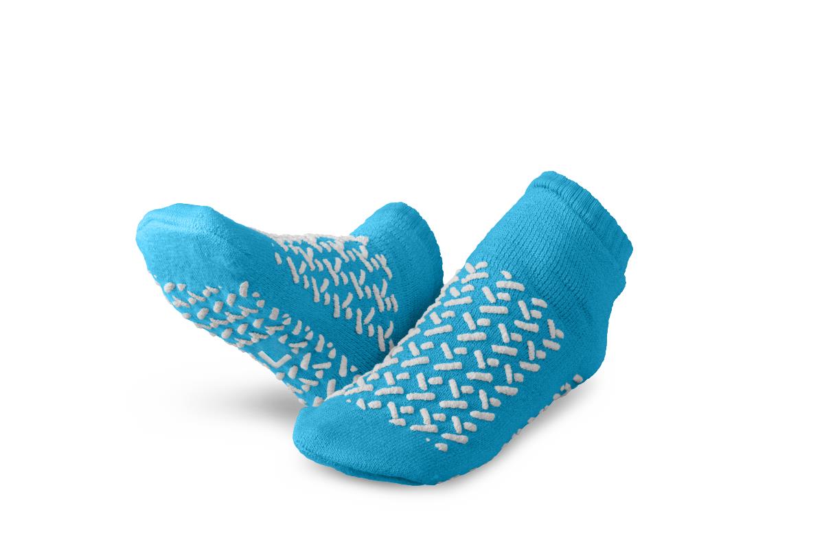 Pair of Medline double-tread terry patient slippers for fall prevention.
