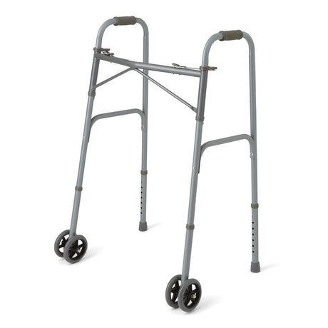 Medline Guardian bariatric folding walker with wheels, front view, in use.
